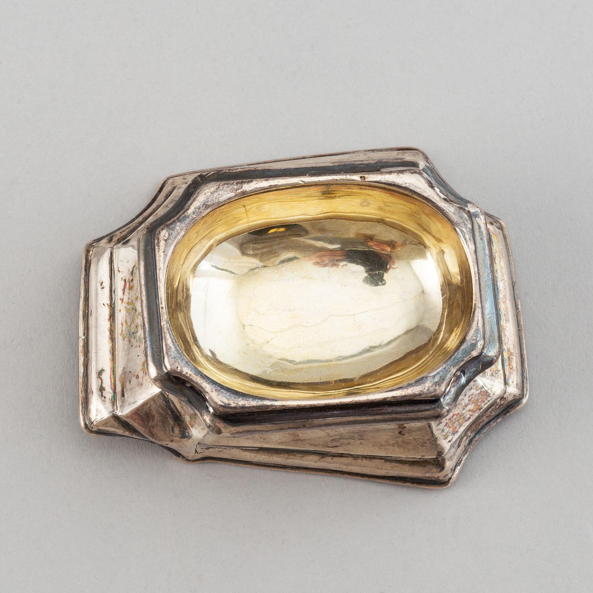Four English early 18th century parcel-gilt silver salt-cellars, mark of Edward Wood, London 1727.