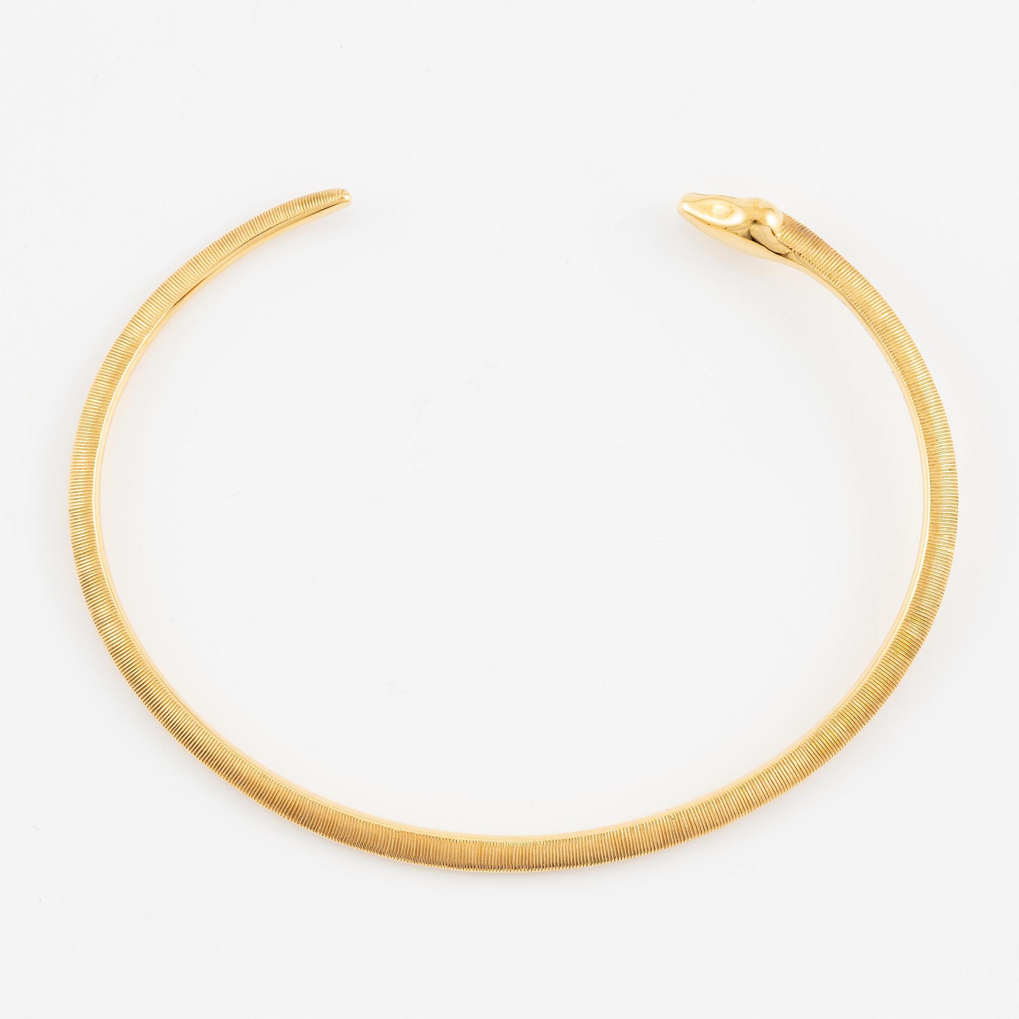 An Ole Lynggaard bracelet 18K gold in the shape of a snake.