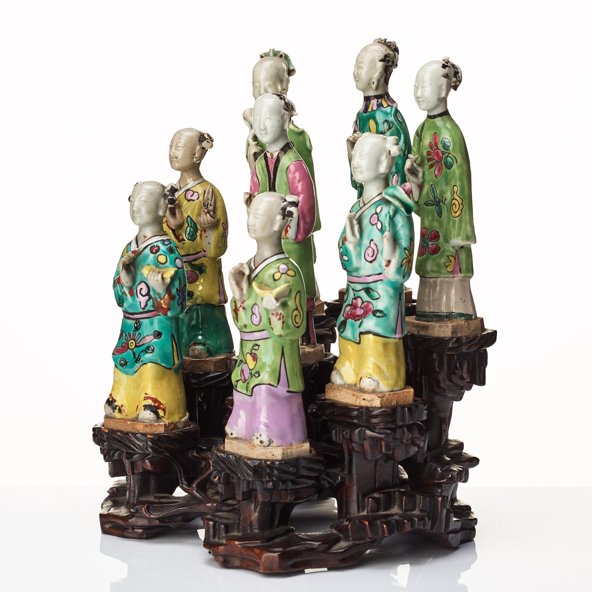 A group of eight immortals on  wooden stand, Qing dynasty, 19th Century.