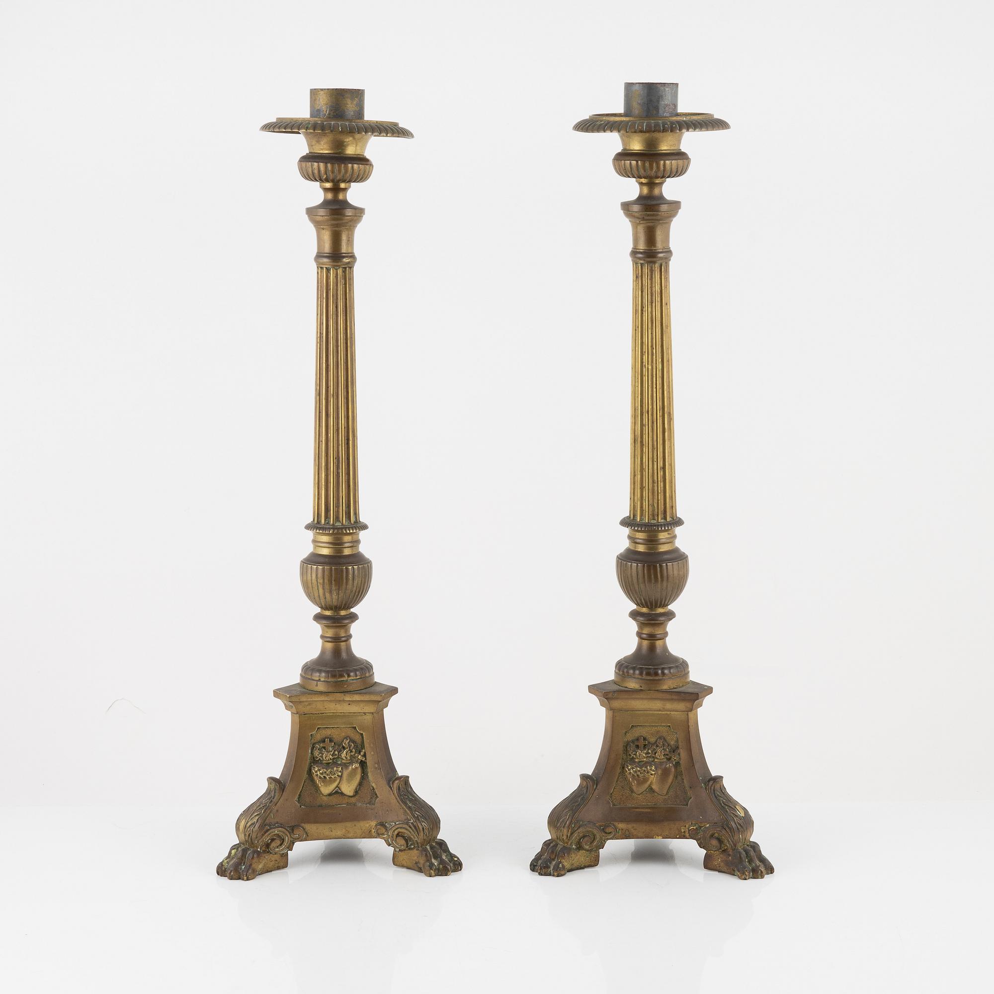A pair of Baroque style brass altar candleholders, circa 1900.