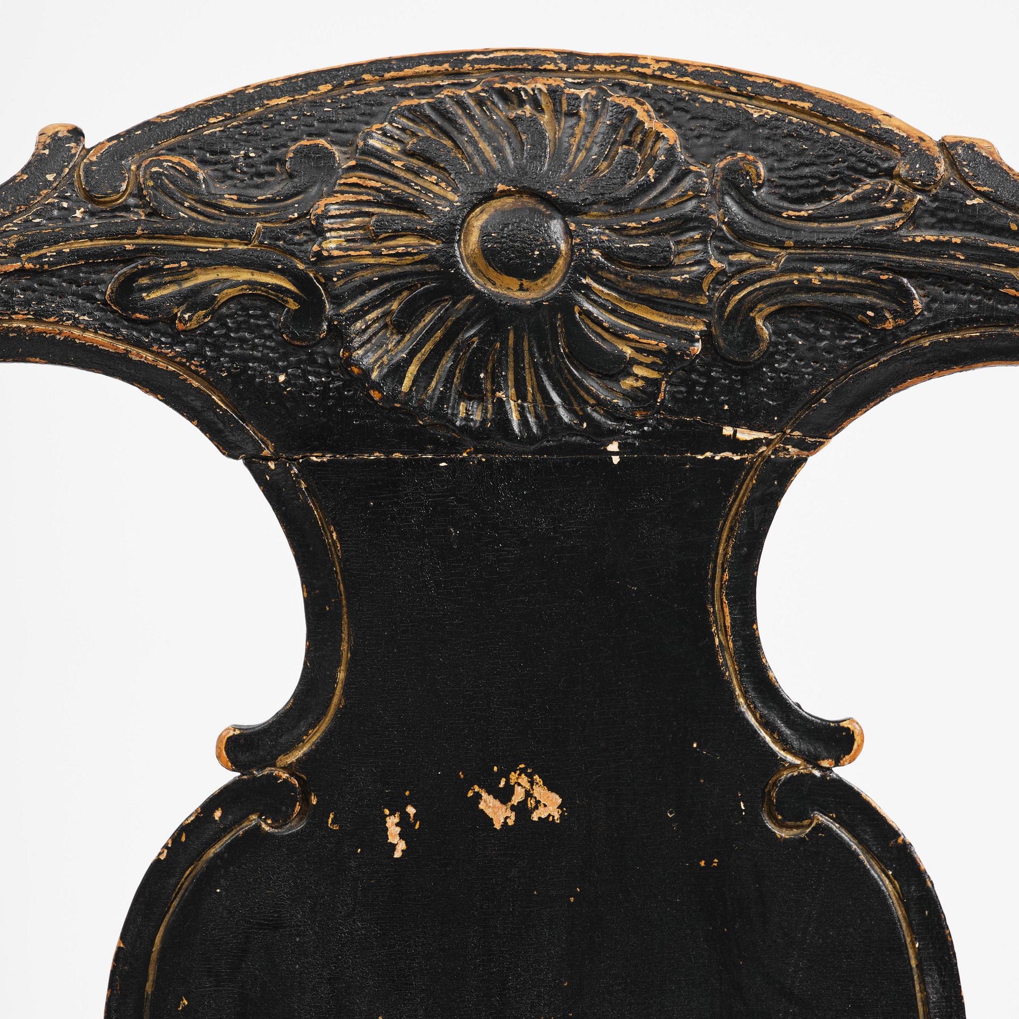 A pair of rococo armchairs in the manner of C. M. Sandberg, later part 18th century.