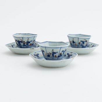 Three Chinese porcelain cups and saucers, Qing dynasty, 18th century.