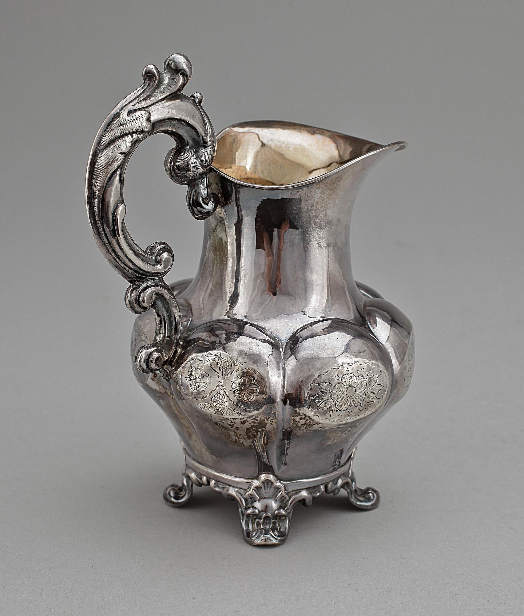 GRÄDDKANNA, silver, nyrokoko, Johan Olof Östlund, Gällivare 1865. Vikt ca 168 g.