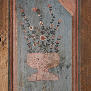 A folk-art cabinet attributed to  "Gammelmålaren" Anders Nilsson (Brunskog, 1807–1889).