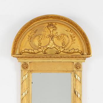 A giltwood Empire mirror by J. P. Holmberg (active in Stockholm 1813 - 1831).