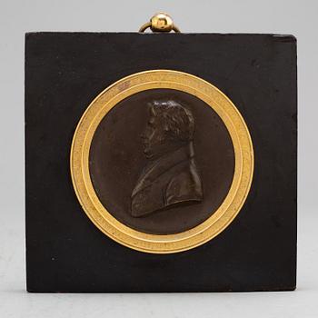 A Swedish Empire copper and gilt bronze portrait medallion representing Jöns Jacob Berzelius.