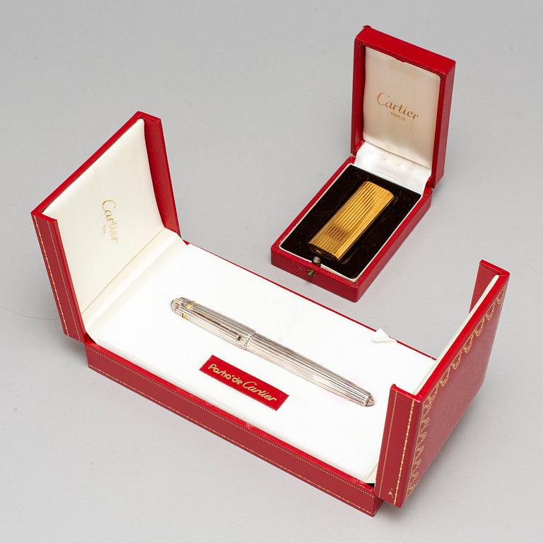 CARTIER, a fountain pen and a lighter.