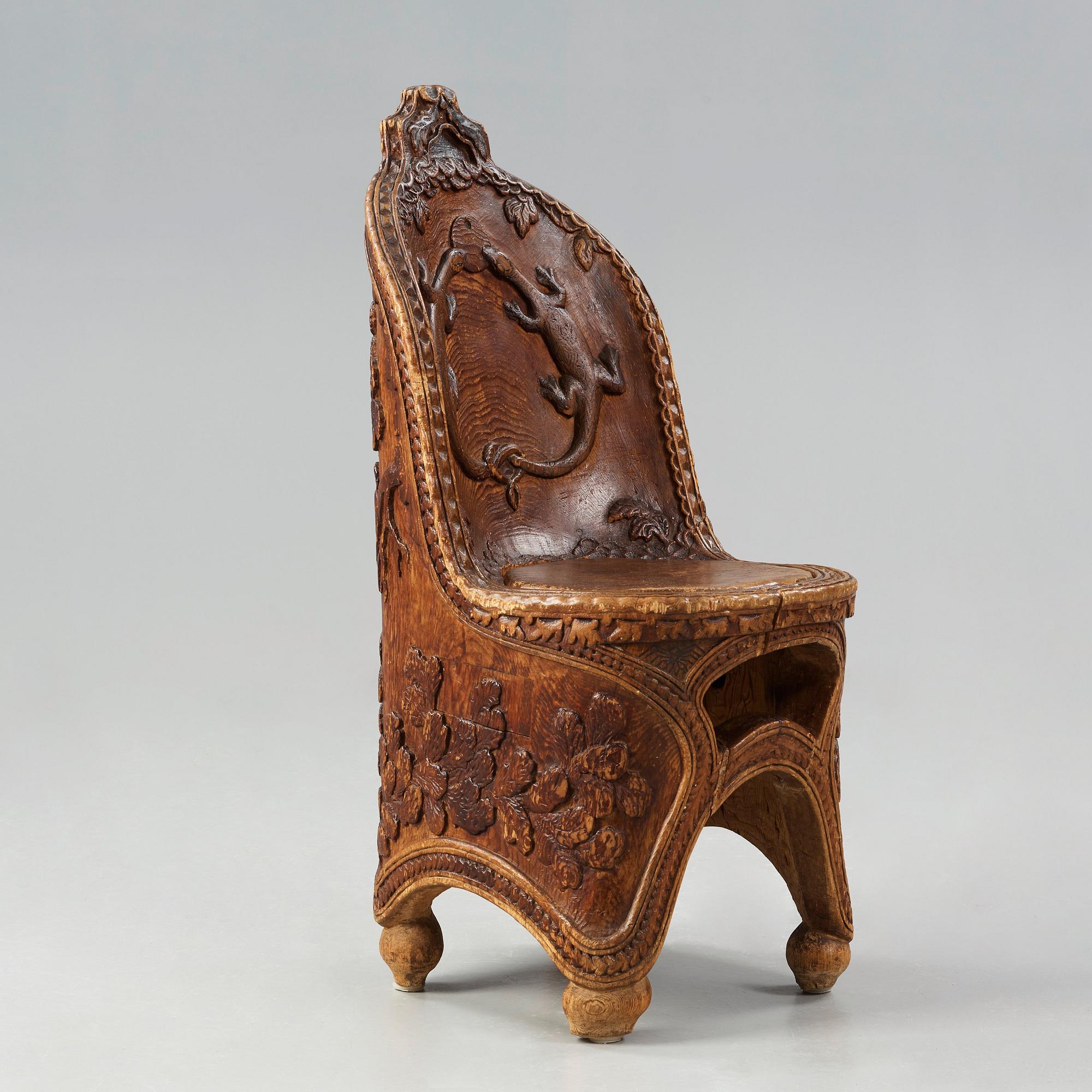 Knut Fjaestad, an Art Nouveau folk art sculptured pine chair, Sweden early 1900's.