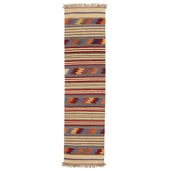 A persian kilim runner, c 246 x 64 cm.