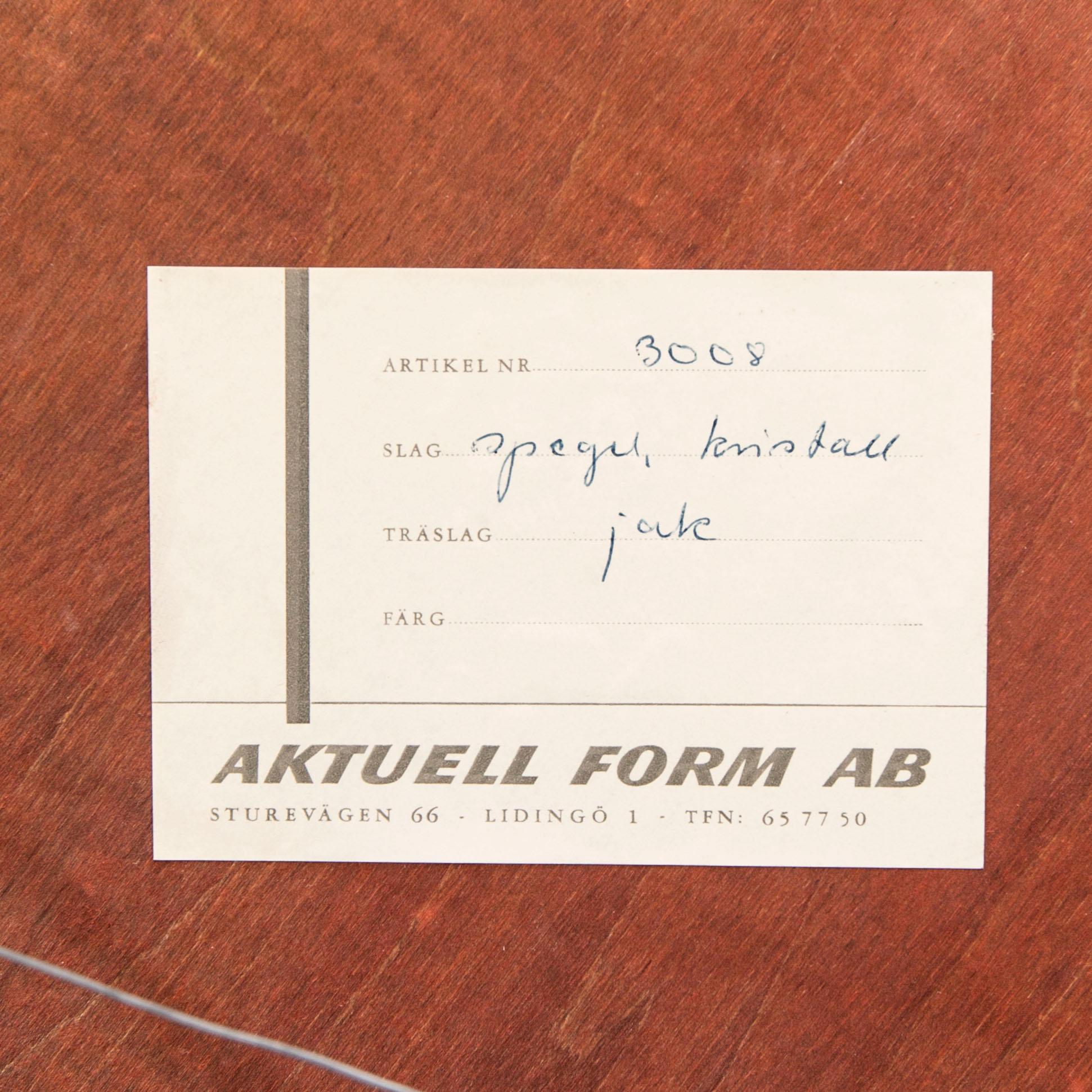 A Sigvard Bernadotte jacaranda mirror for Aktuell Form later part of the 20th century.