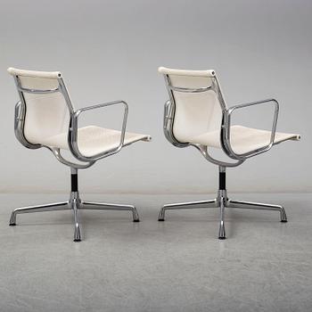 A pair of EA 107 chairs by Charles & Ray Eames, Vitra.