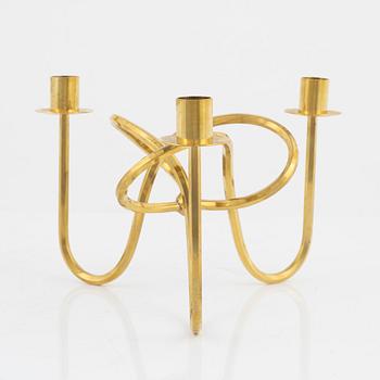 Josef Frank, a brass candelabrum, 'Vänskapsknuten', Svenskt Tenn.