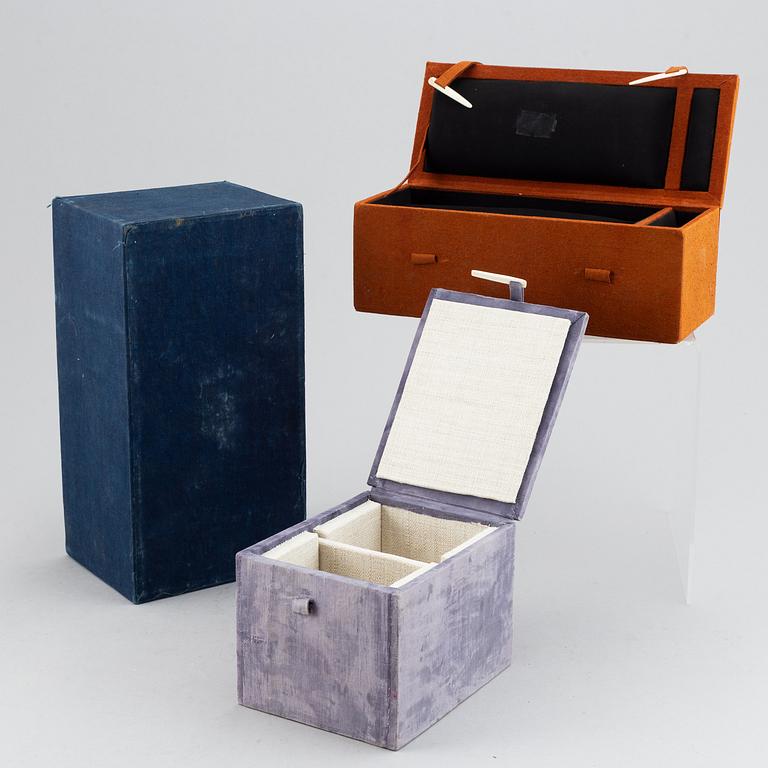 A set of seven Chinese and Japanese boxes, wood or textile clad, 19th/20th Century.