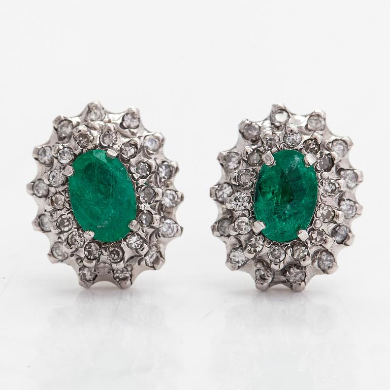 Earrings, 8K white gold with oval faceted emeralds and round brilliant and single-cut diamonds.