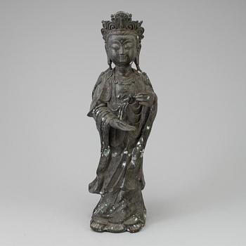 A standing figure of a Buddha.