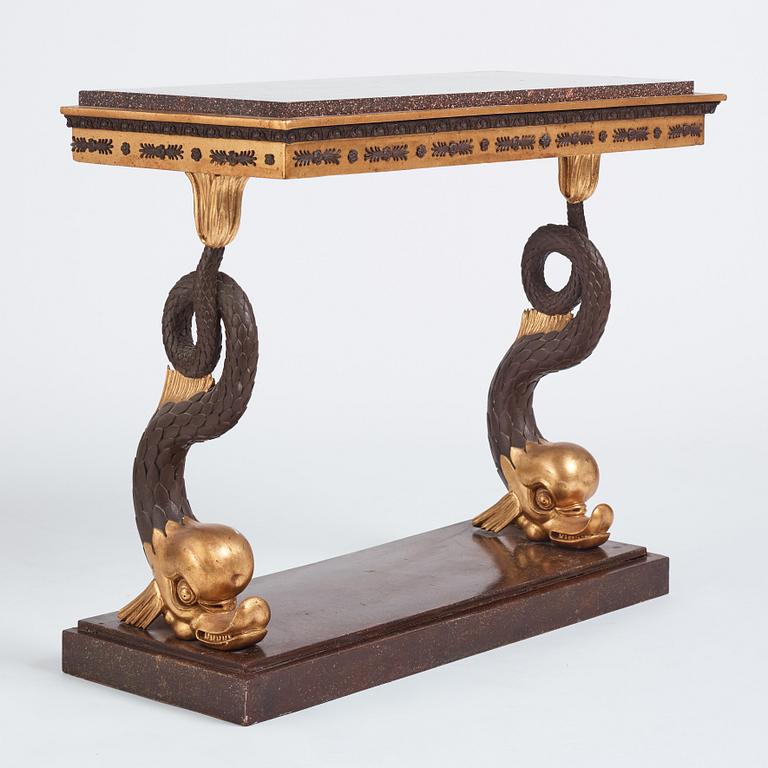 A Swedish Empire porphyry and giltwood console table, early 19th century.