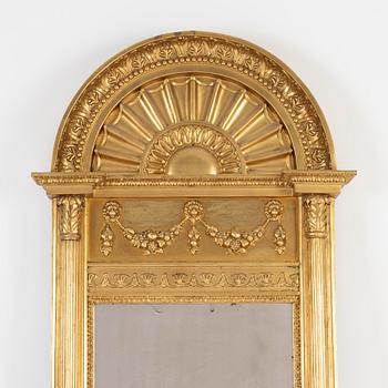 An Empire mirror, first half of the 19th Century.