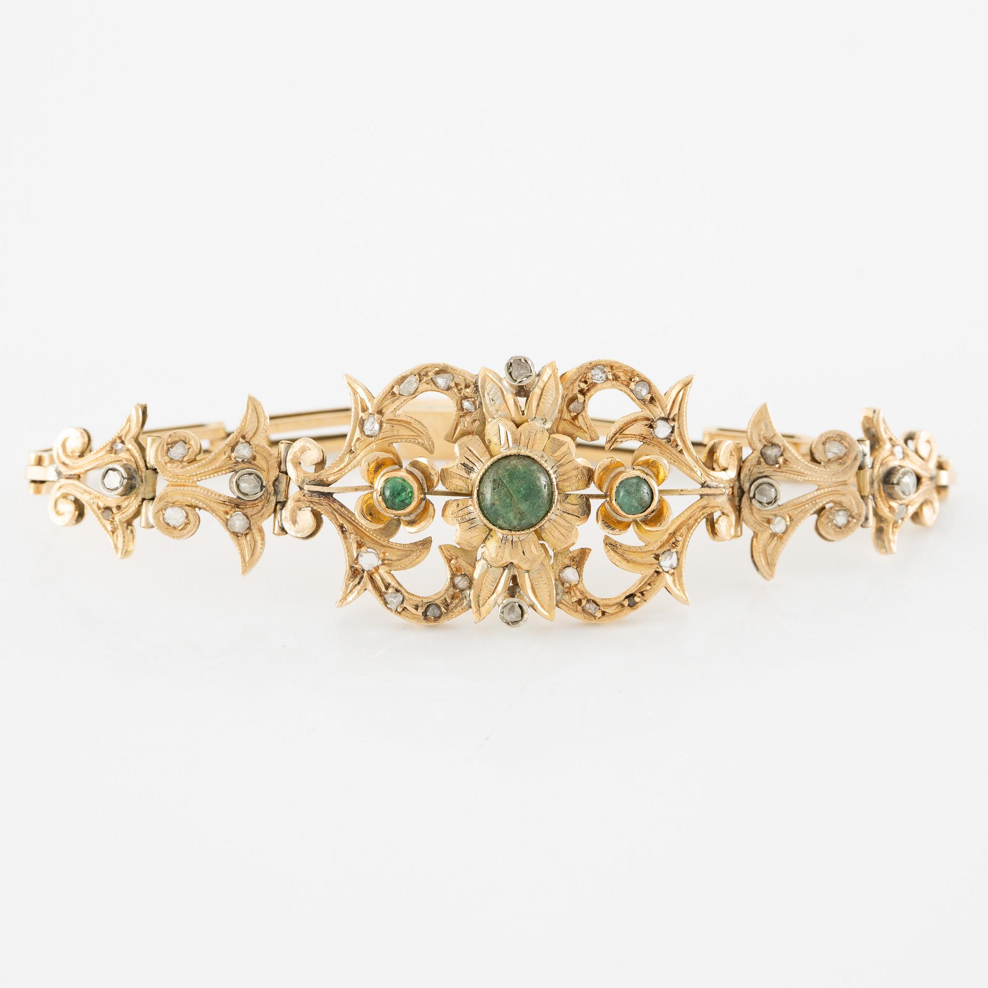 Necklace and bracelet in with floral motif set with cabochon-cut emeralds and rose-cut diamonds.