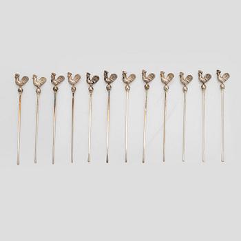 A set of 12 silver glass coasters, Auran Kultaseppä Oy Turku 1935 and 1983, and cocktail sticks, 12 pcs silver.