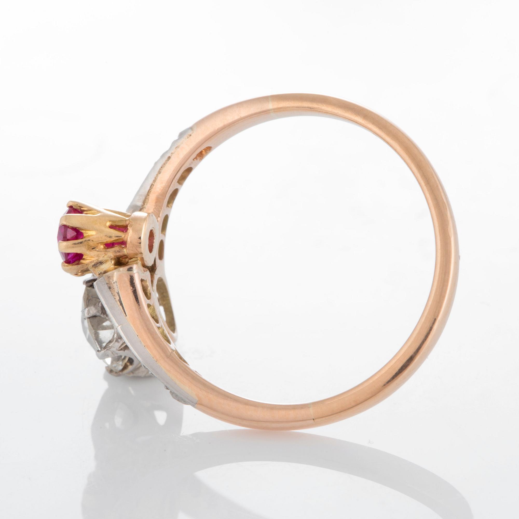 A ring set with an old-cut diamond ca 0.75 ct quality ca K-L vs and a faceted ruby.