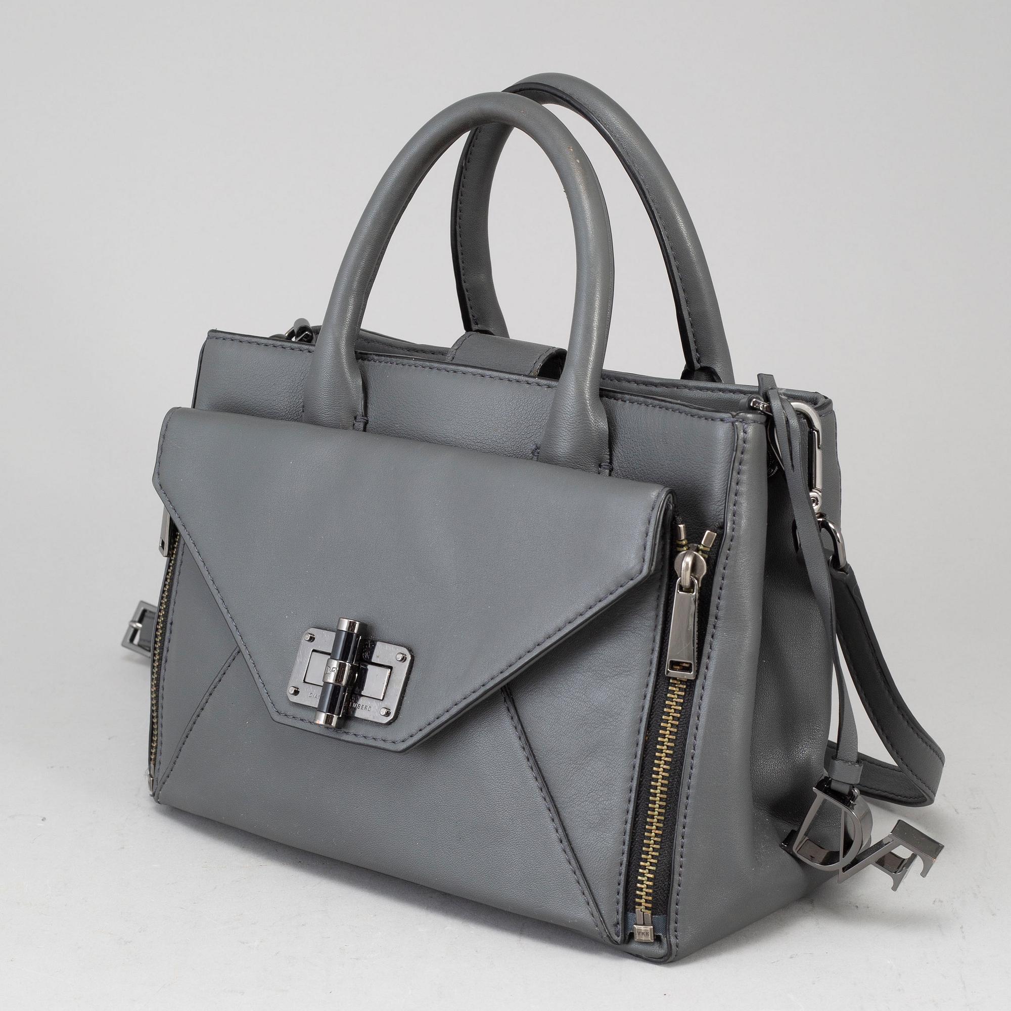 DIANE VON FÜRSTEBERG, a grey leather 'DVF Secret Agent' bag.