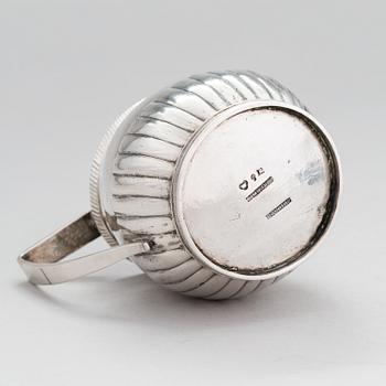 A silver, cream jug, Cyrillic maker's mark Sinkoni, Finland 1824.