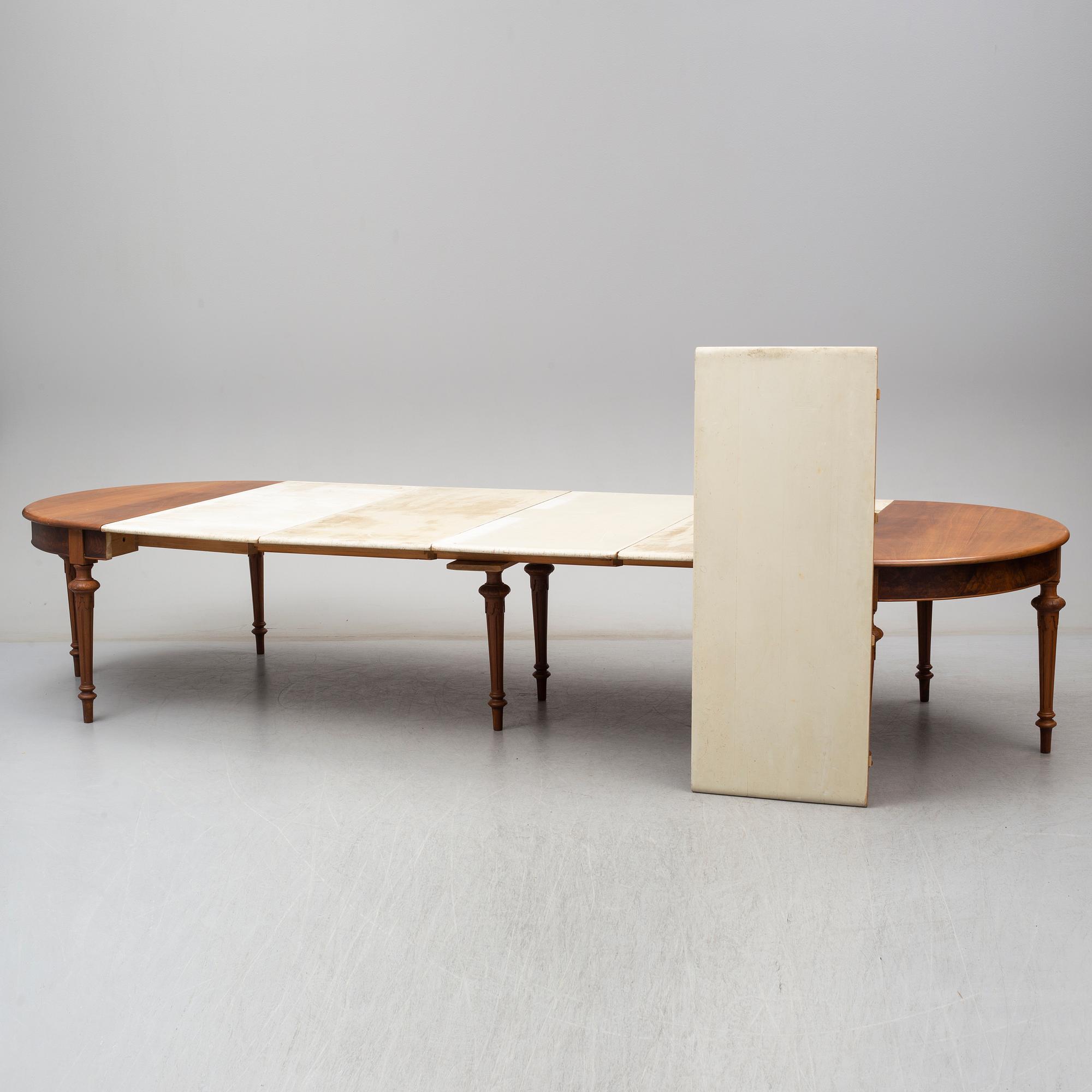 A DINING TABLE, second half of the 19th century. 5 painted leaves included.