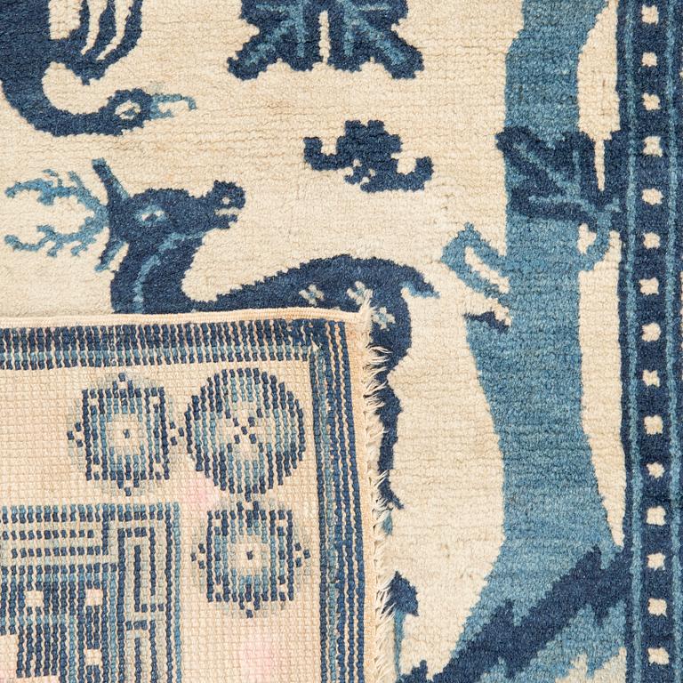 A Chinese Baotou carpet semiatnique approx 127x64 cm.