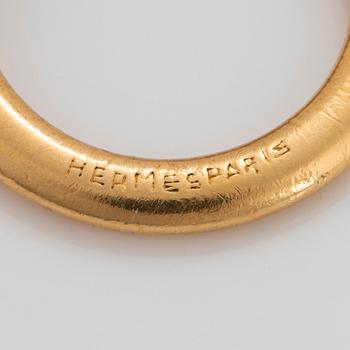 Hermès nyckelring i form av en uggla 18K guld med rubiner.