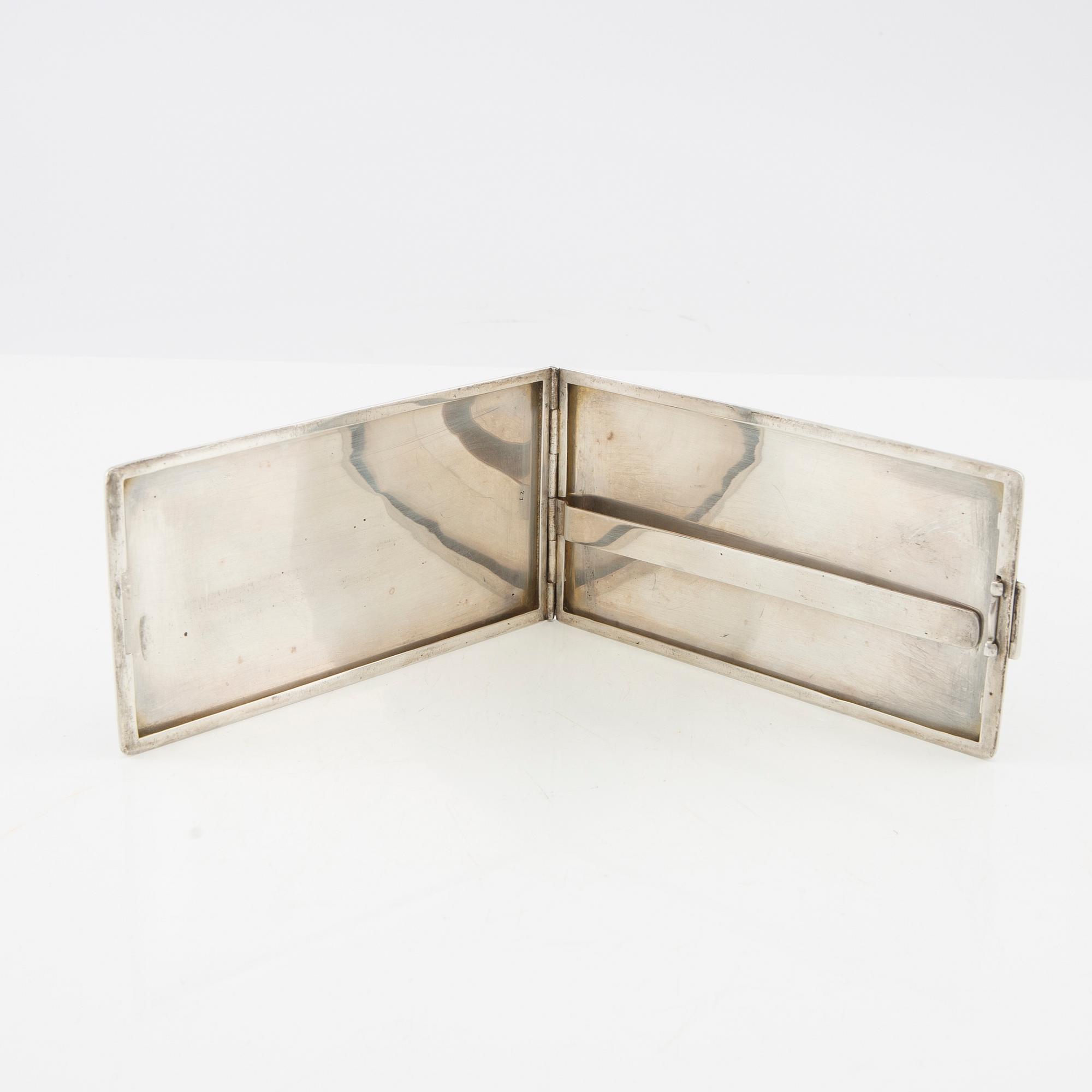 American silver cigarette case with engraving from World War II.