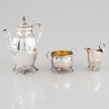 A Swedish Silver Coffee Pot, Creamer and Sugar Bowl, mark of GAB, Stockholm 1910-11.