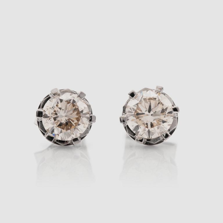 A pair of brilliant-cut diamond earrings. Total carat weight circa 1.40 cts.