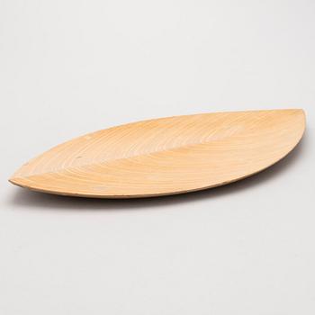 A plywood dish signed TW.