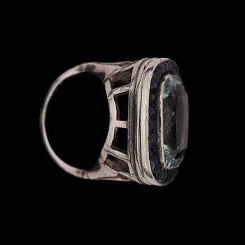 An aquamarine and sapphire ring.