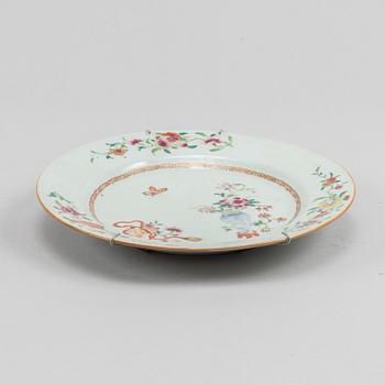 A famille rose dish and two dinner plates, Qing dynasty, Qianlong (1736-95).