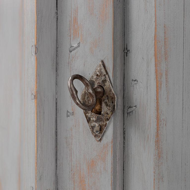 A painted corner cabinet, 19th Century.