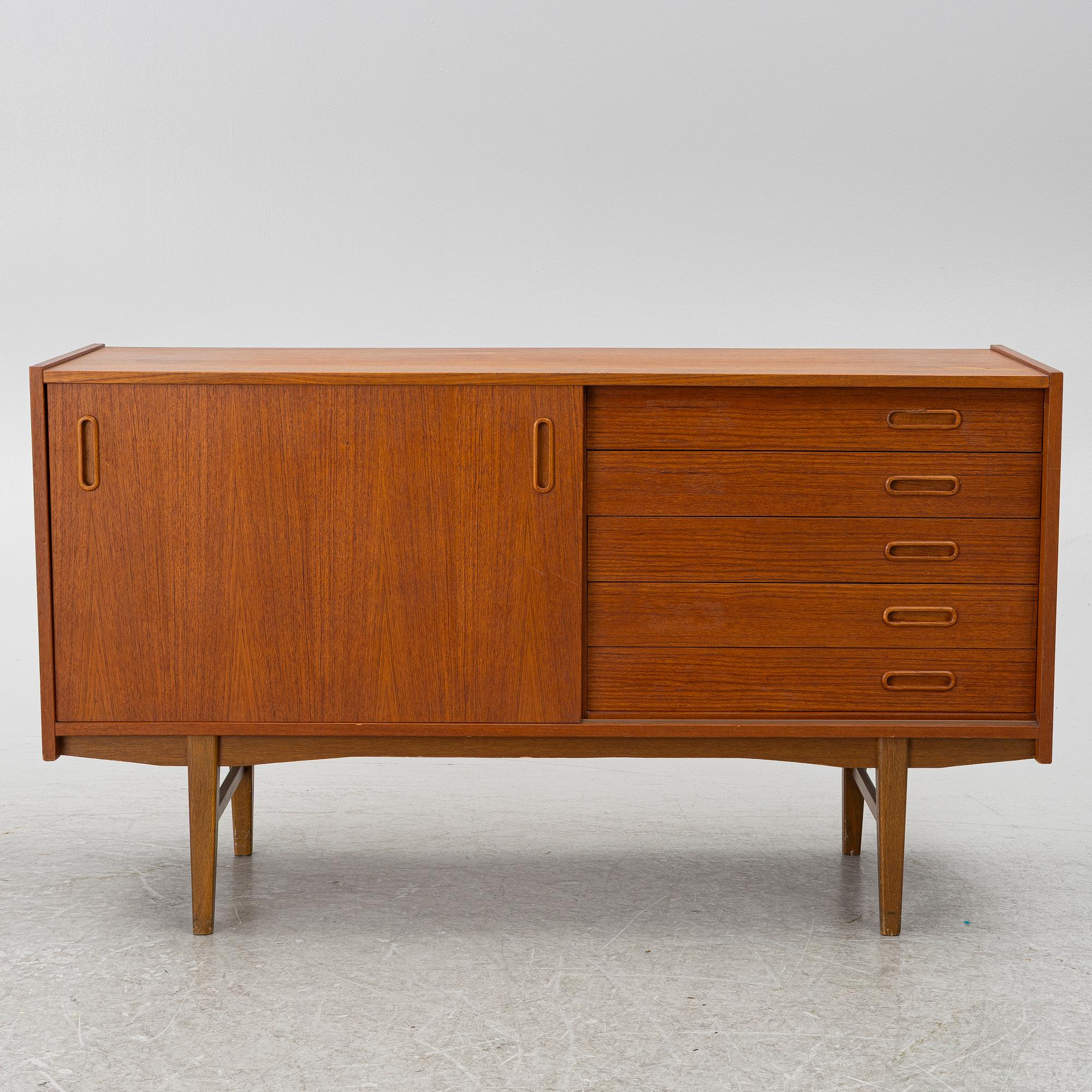 A 1950's teak veneered sideboard.