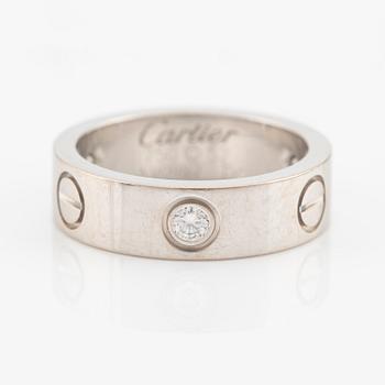 Cartier "Love" ring in 18K white gold with three round brilliant-cut diamonds.