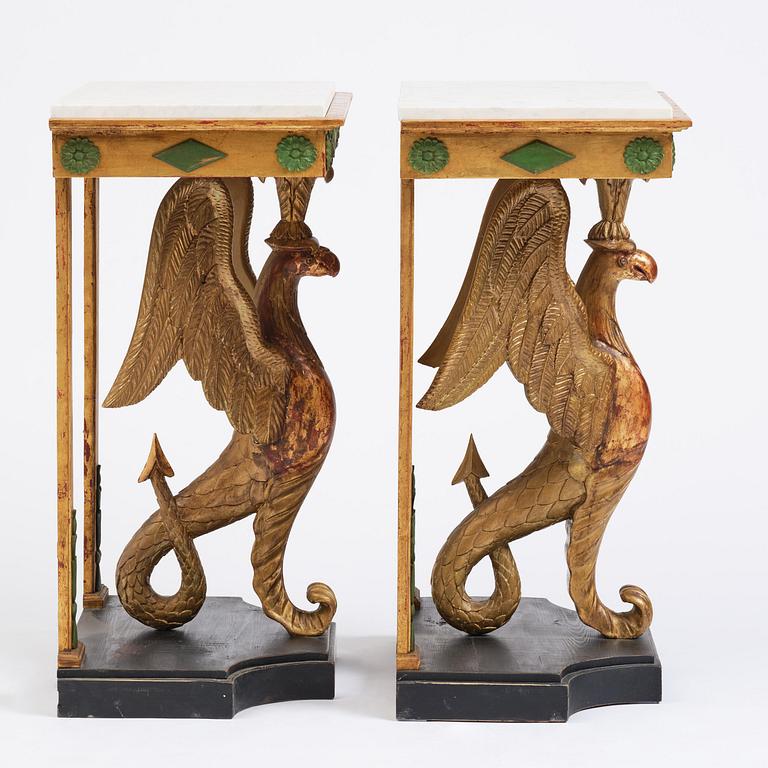 A pair of giltwood console tables, Empire-style incorporating older elements.