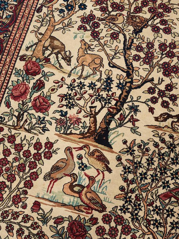 A CARPET, a semi-antique Esfahan figural, 215,5 x 140,5 cm.