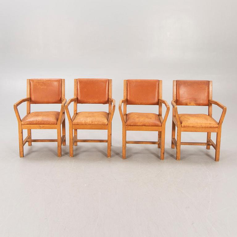 A set of four 1970:s Tage Poulsen Daumiller oak and leather armchairs for GM Möbler Denmark.