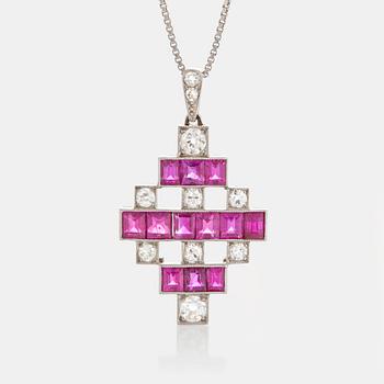 1105. An 18K white gold pendant set with step-cut rubies and old-cut dimonds.