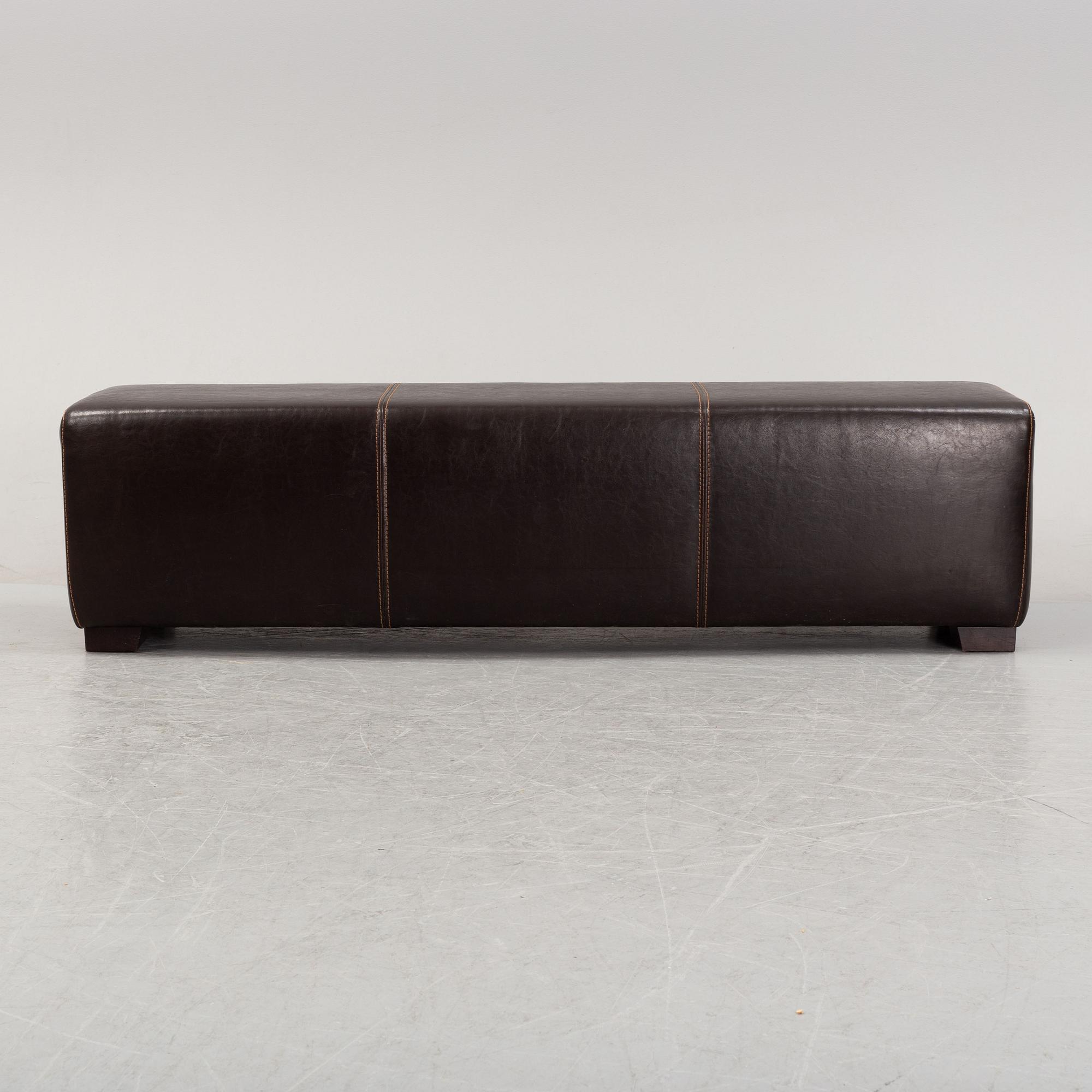 A leather-upholstered bench from Industria Divani e Poltrone, Italy.