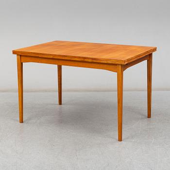 A second half of the 20th century teak veneered dining table.