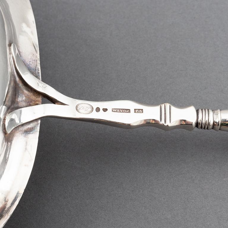 Two 19th century Swedish silver soup-ladles and a silver brandy-ladle.