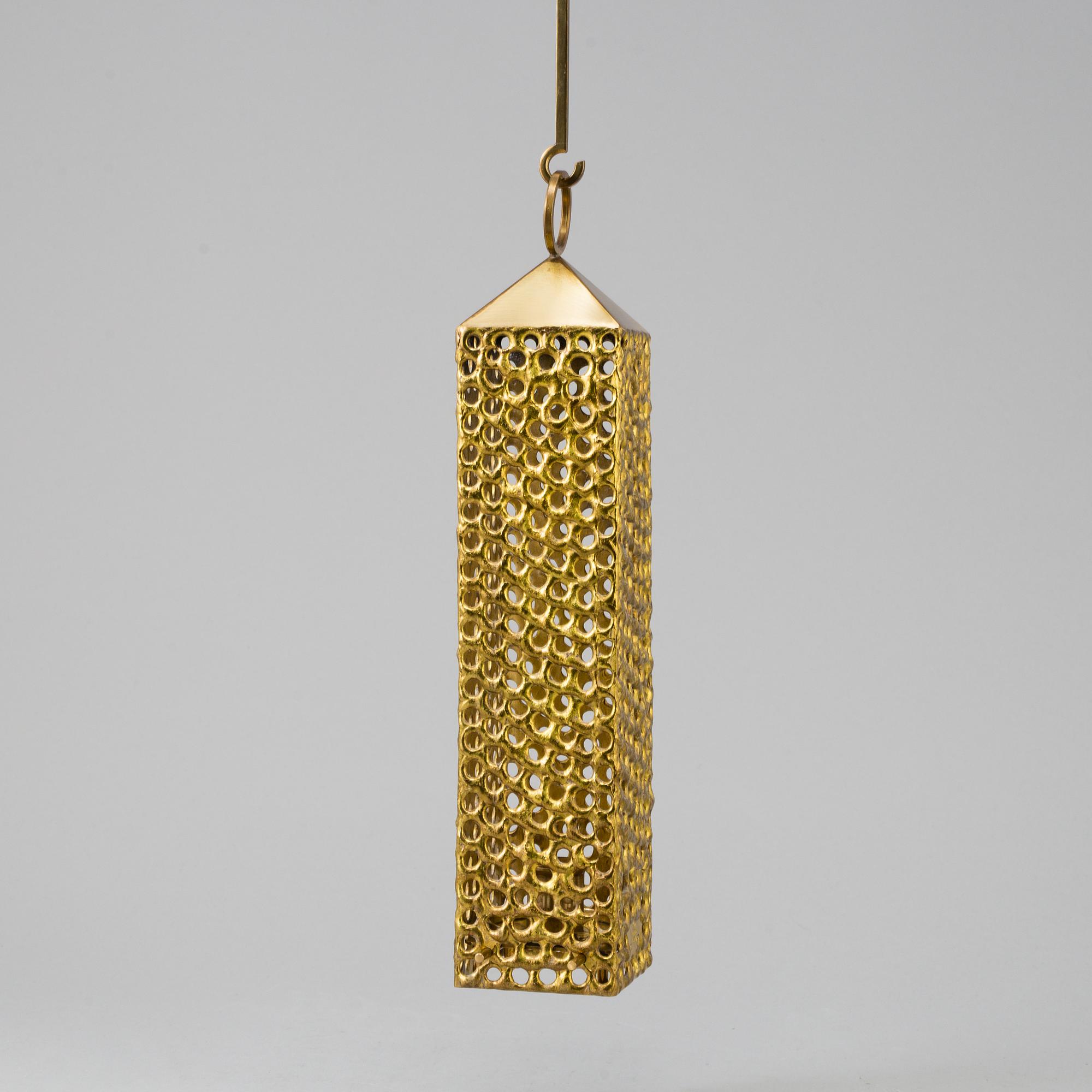 a brass ceiling light by Pierre Forsell for Skultuna.