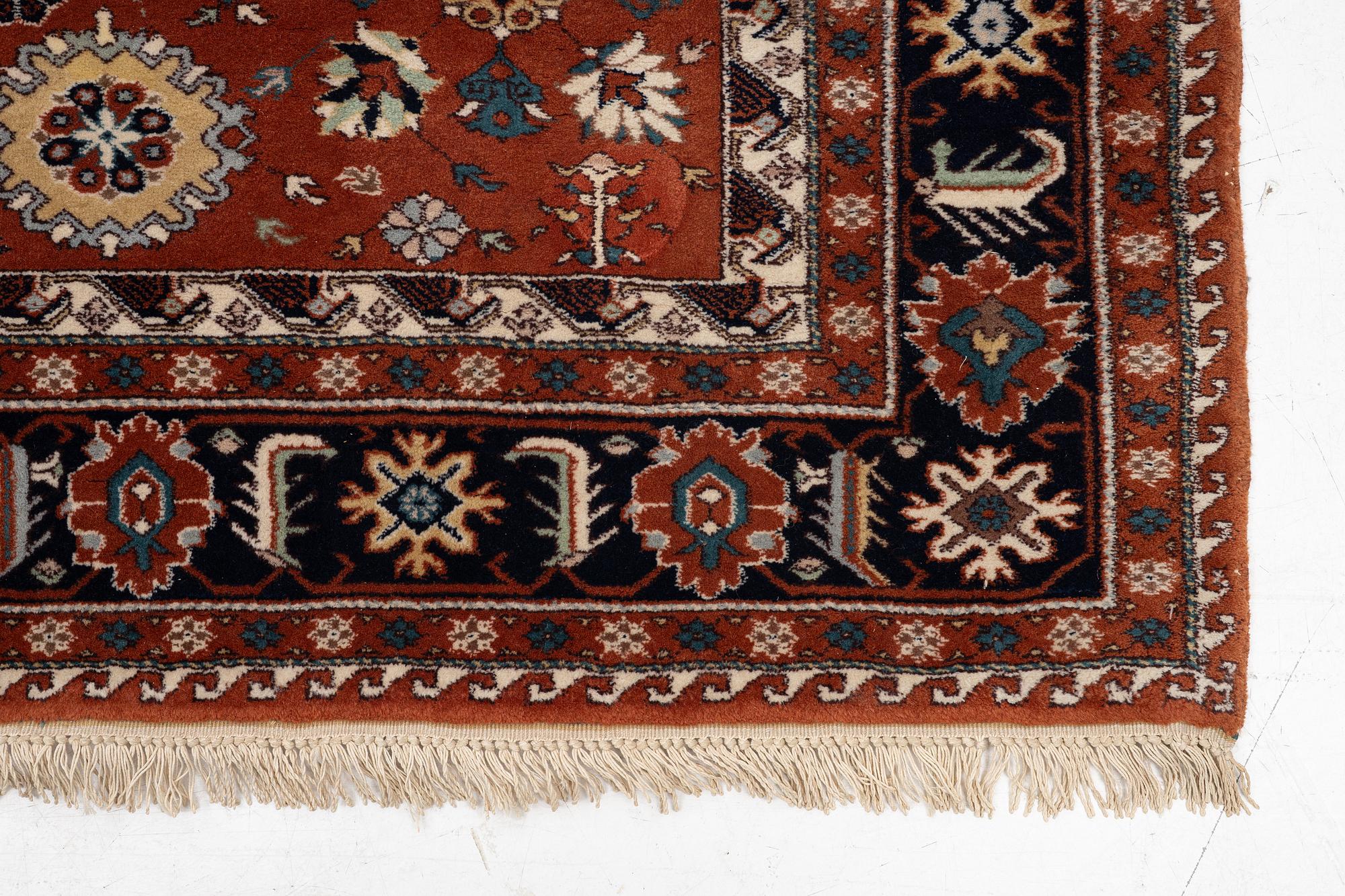 A semi-antique Orientall carpet c. 318 x 202 cm.