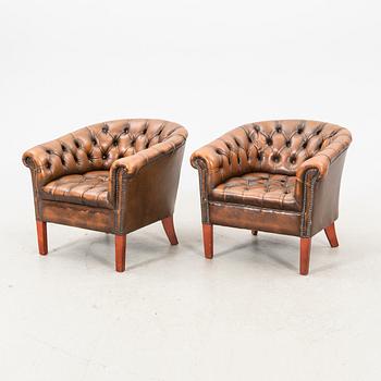 A pair of leather armchairs. second half of the 20th century.
