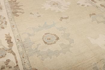 An Ushak design carpet, c. 442 x 317 cm.