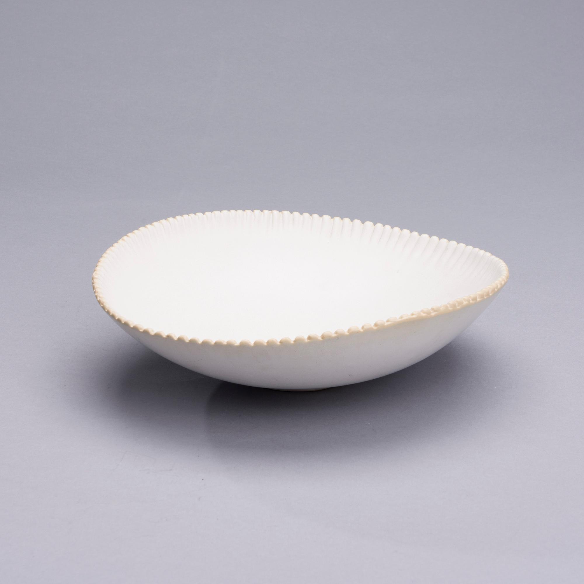 TOINI MUONA, A CERAMIC DISH. Signed TM, Arabia.